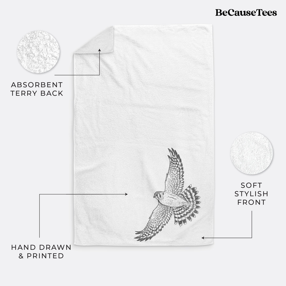 White hand towel printed with a detailed black ink illustration of an American kestrel in flight with its wings raised.
