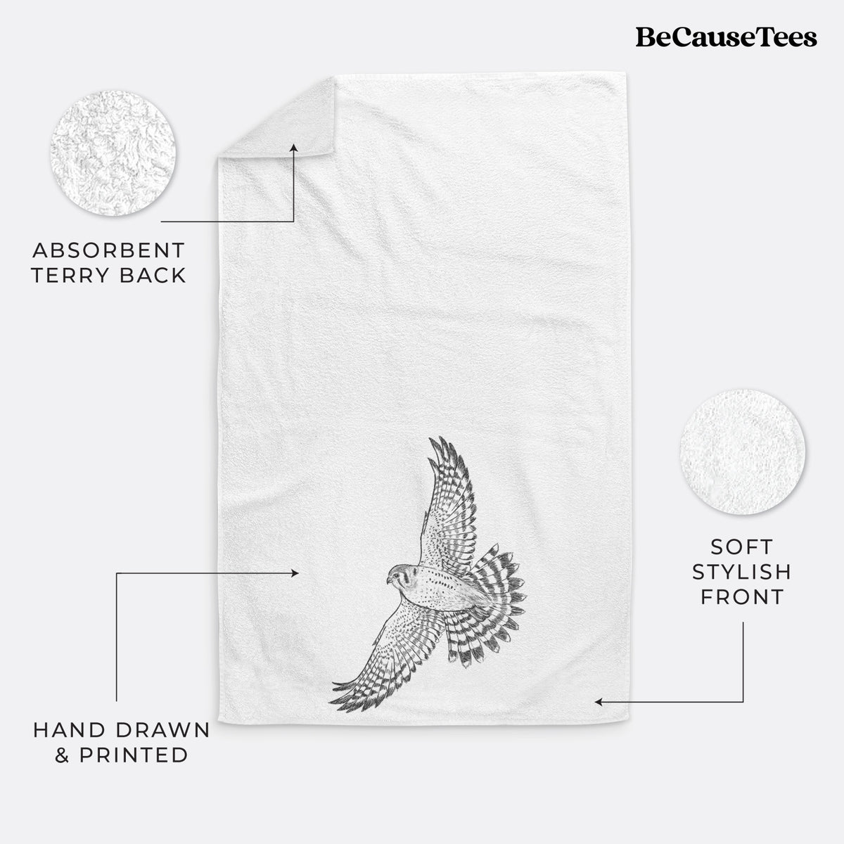 White hand towel printed with a detailed black ink illustration of an American kestrel in flight with its wings raised.