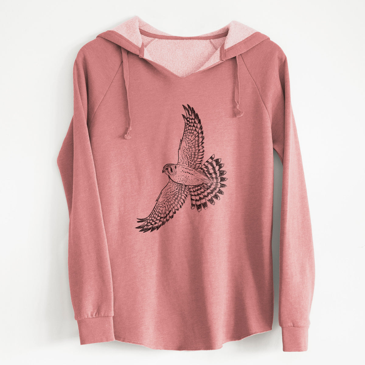 Dusty rose women's Cali Wave hooded sweatshirt laid flat, printed with a detailed black ink illustration of an American kestrel in flight with its wings raised.
