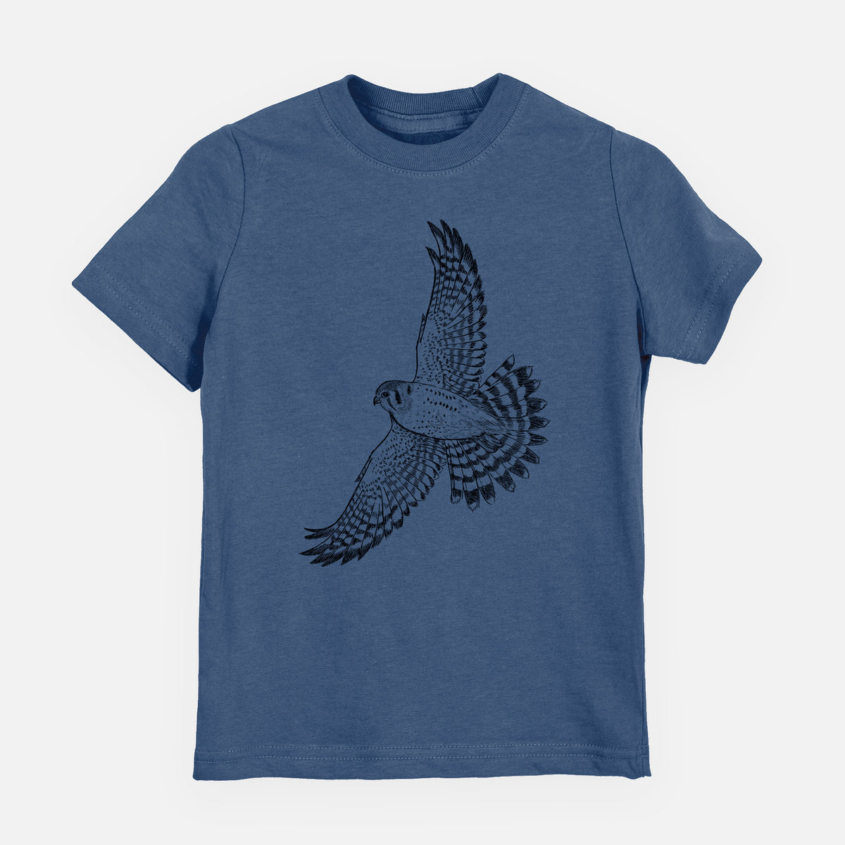 Indigo blue youth t-shirt laid flat, printed with a detailed black ink illustration of an American kestrel in flight with its wings raised.