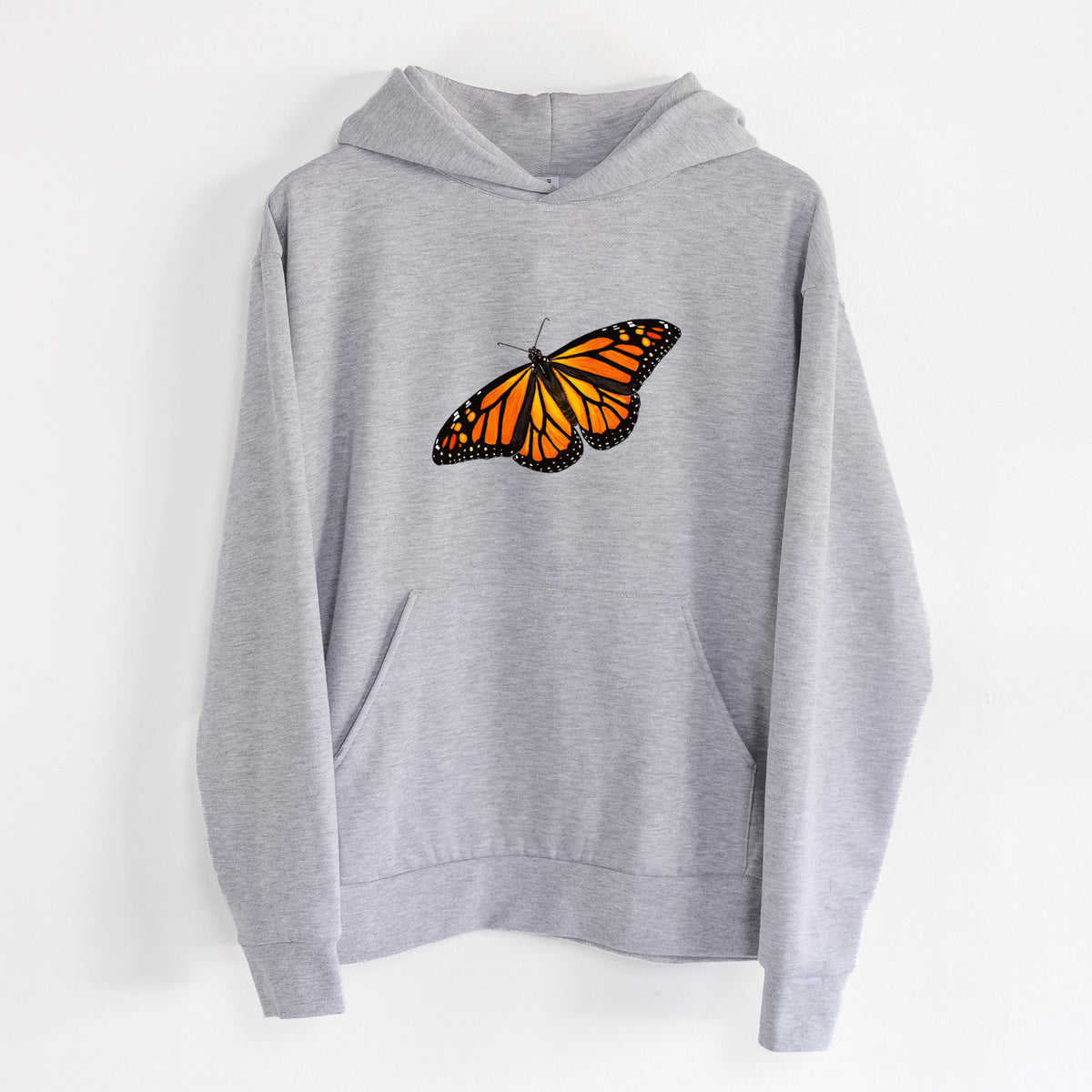 Vibrant Monarch - Danaus plexippus - Statement Midweight Hoodie in Heather Grey, hanging on a white wall, with a front kangaroo pocket and no drawcords.
