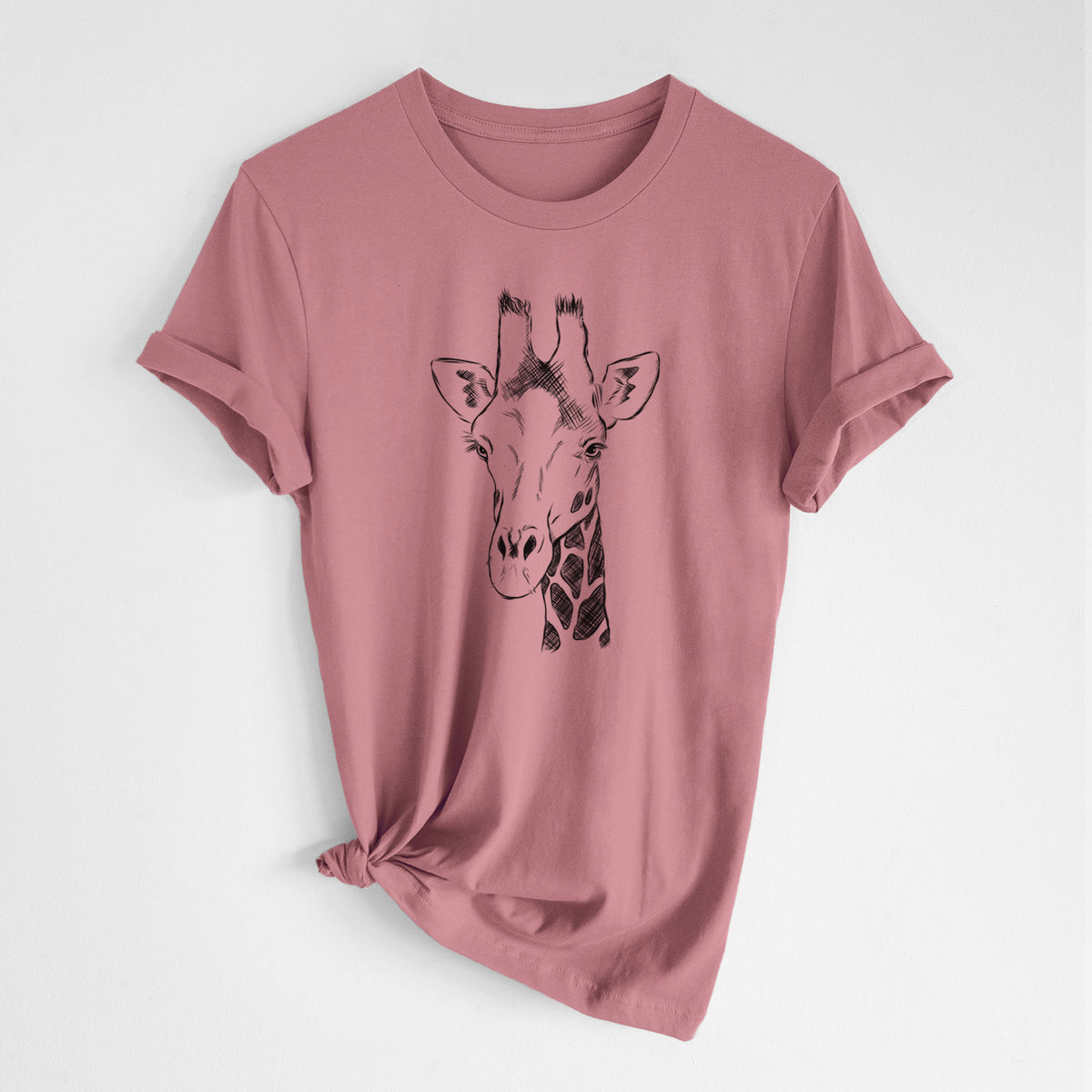 Mauve pink lightweight cotton t-shirt laid flat with the sleeves rolled, printed with a black ink portrait of a southern giraffe's head and neck.