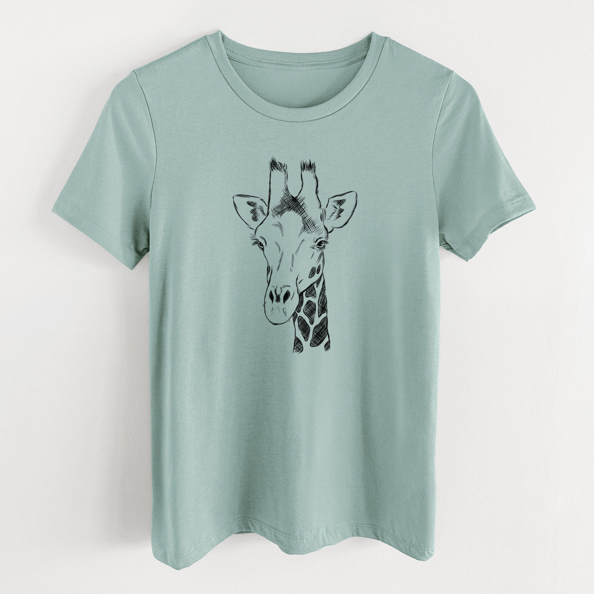 Dusty blue women's relaxed fit cotton t-shirt laid flat, printed with a black ink portrait of a southern giraffe's head and neck.