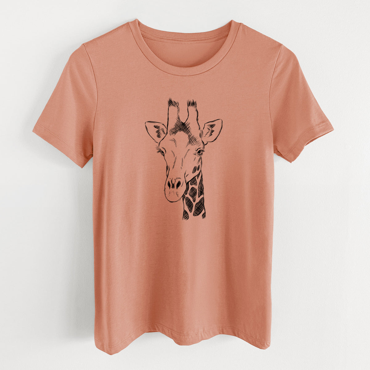 Terracotta orange women's relaxed fit cotton t-shirt laid flat, printed with a black ink portrait of a southern giraffe's head and neck.