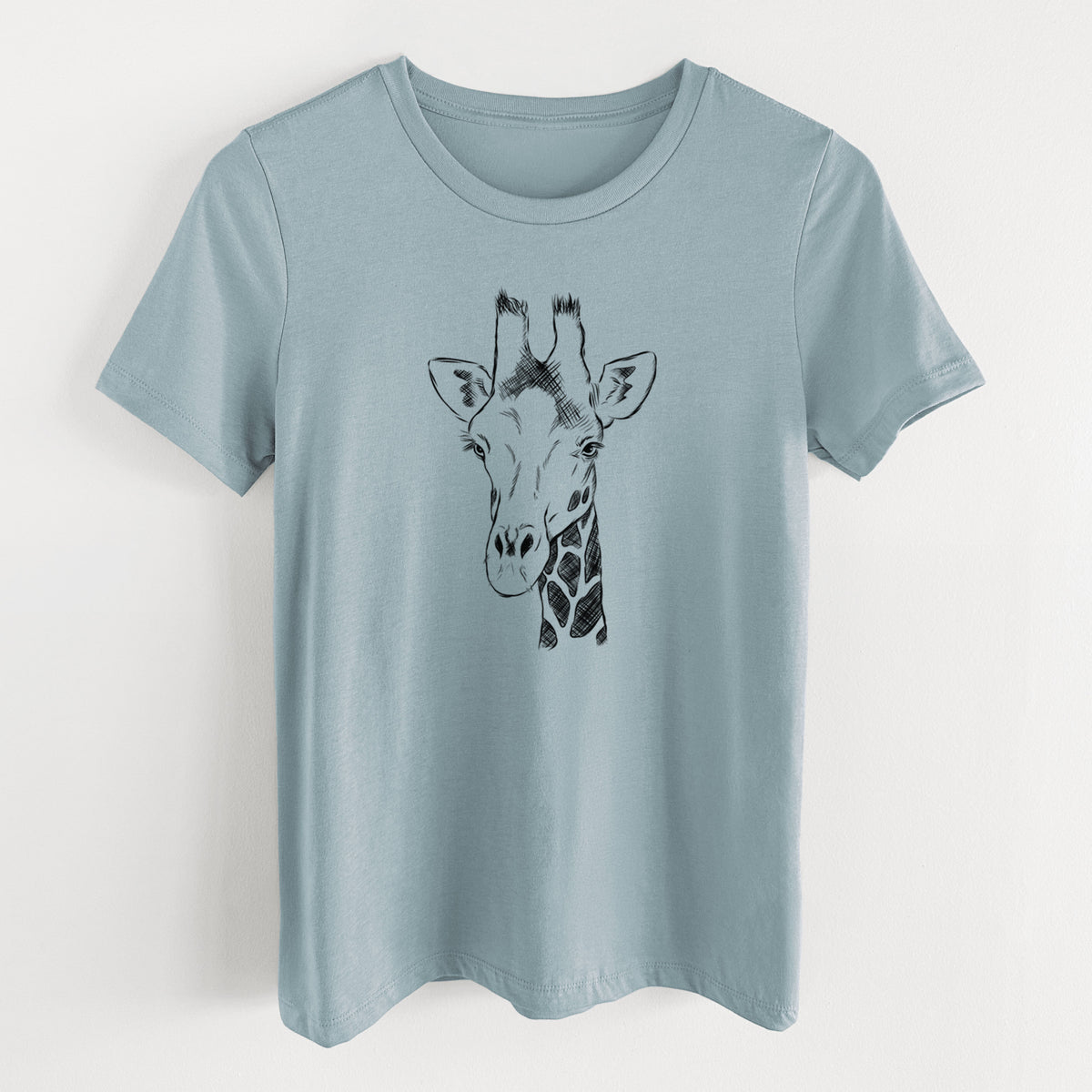 Vintage denim women's relaxed fit cotton t-shirt laid flat, printed with a black ink portrait of a southern giraffe's head and neck.