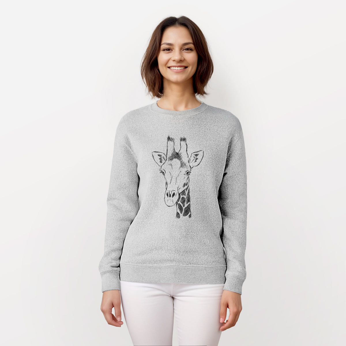 Woman wearing a knit sweatshirt printed with a black ink portrait of a southern giraffe's head and neck.