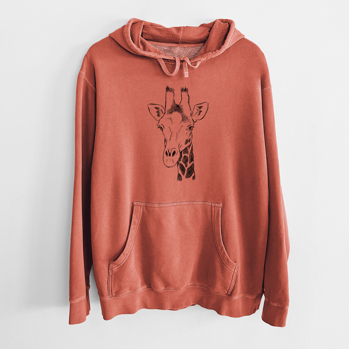 Amber orange pigment dyed hoodie laid flat, printed with a black ink portrait of a southern giraffe's head and neck.