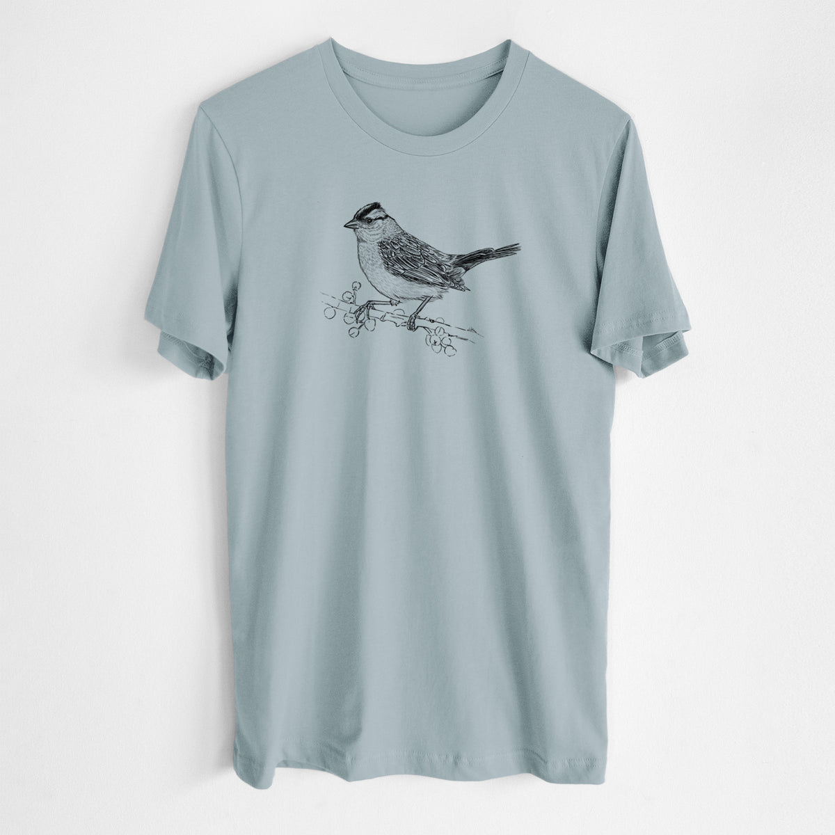 Vintage denim lightweight cotton t-shirt laid flat, printed with a detailed black ink sketch of a white-crowned sparrow perched on a branch.
