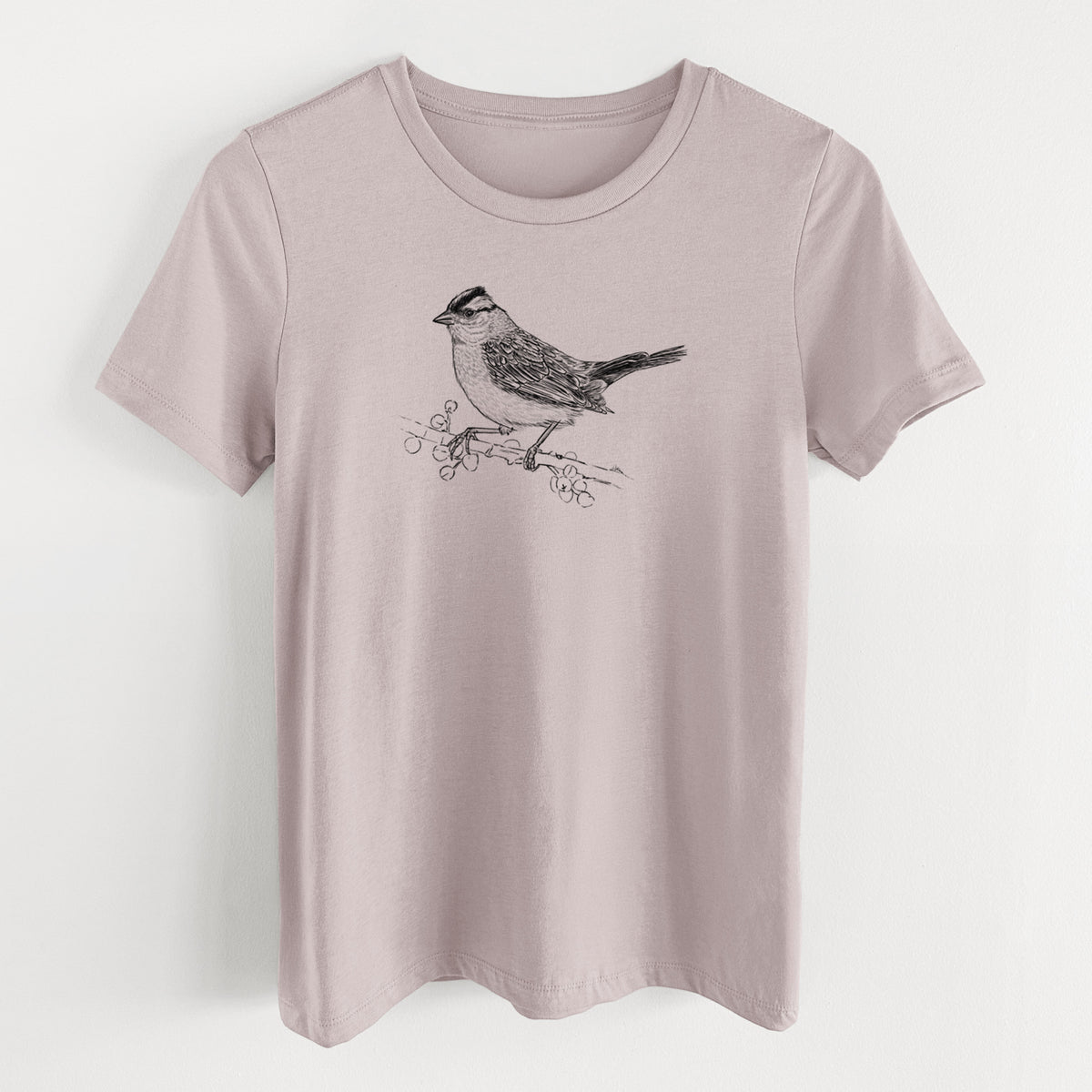 Pink gravel women's relaxed fit cotton t-shirt laid flat, printed with a detailed black ink sketch of a white-crowned sparrow perched on a branch.