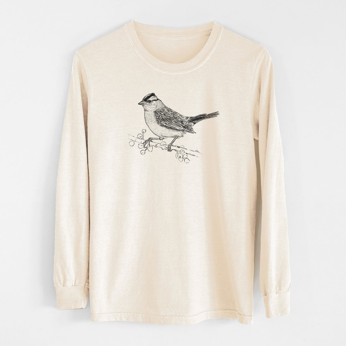 Ivory Comfort Colors long sleeve shirt laid flat, printed with a detailed black ink sketch of a white-crowned sparrow perched on a branch.