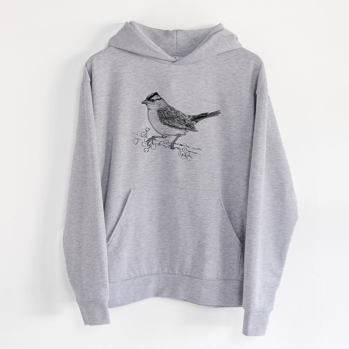 White-crowned Sparrow - Zonotrichia leucophrys - Statement Midweight Hoodie in Heather Grey, hanging on a white wall, with a front kangaroo pocket and no drawcords.