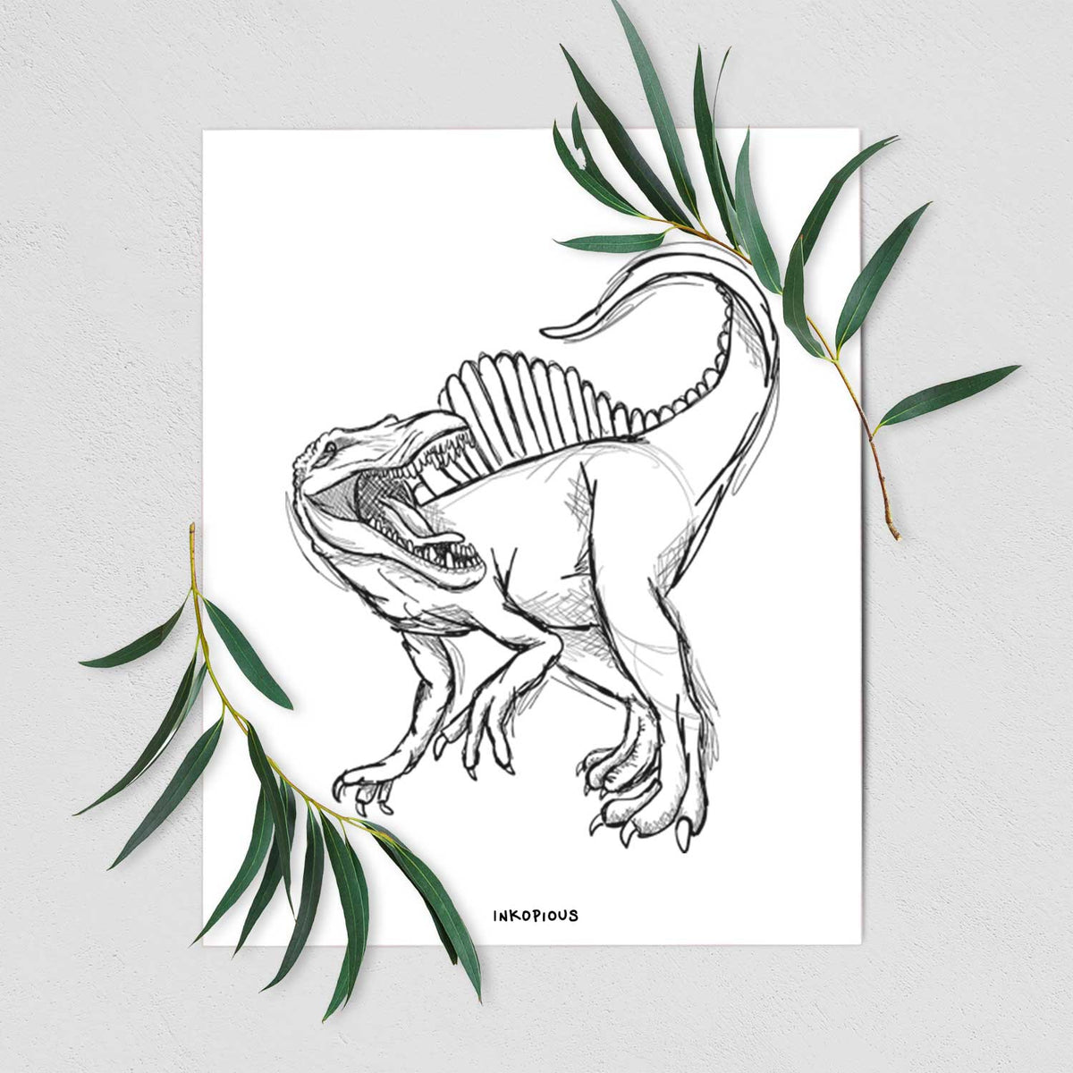 Art print of a black ink illustration of a Spinosaurus with its tall sail-shaped back, shown with eucalyptus leaves.