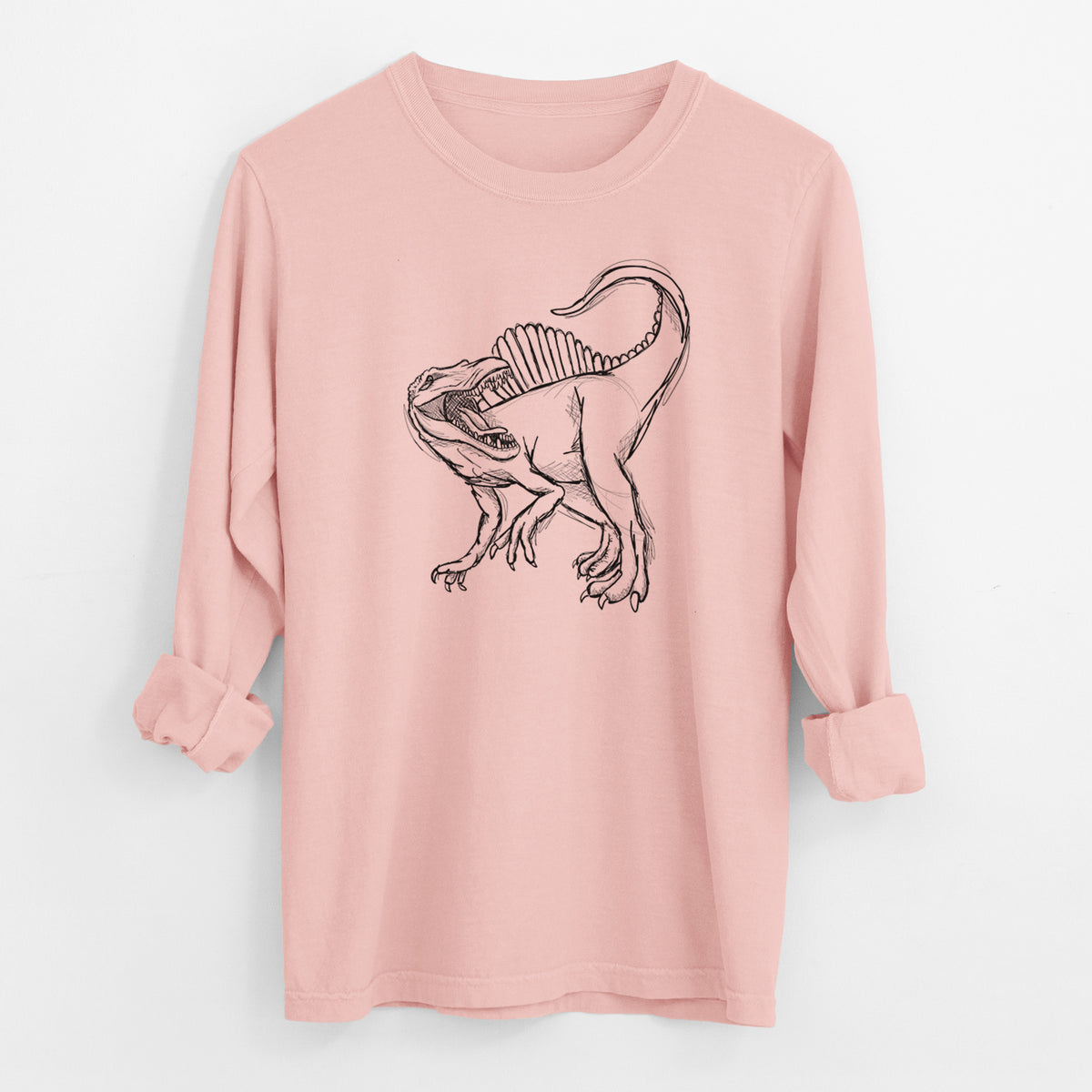 Peachy Comfort Colors long sleeve shirt laid flat with the cuffs rolled, printed with a black ink illustration of a Spinosaurus with its tall sail-shaped back.