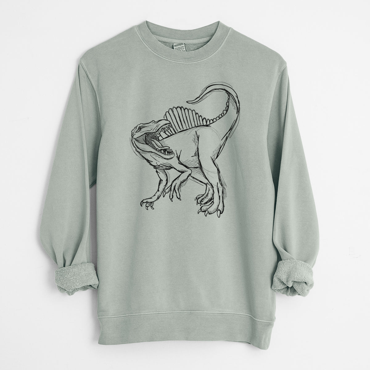 Sage green pigment dyed crewneck sweatshirt laid flat with the sleeves rolled, printed with a black ink illustration of a Spinosaurus with its tall sail-shaped back.