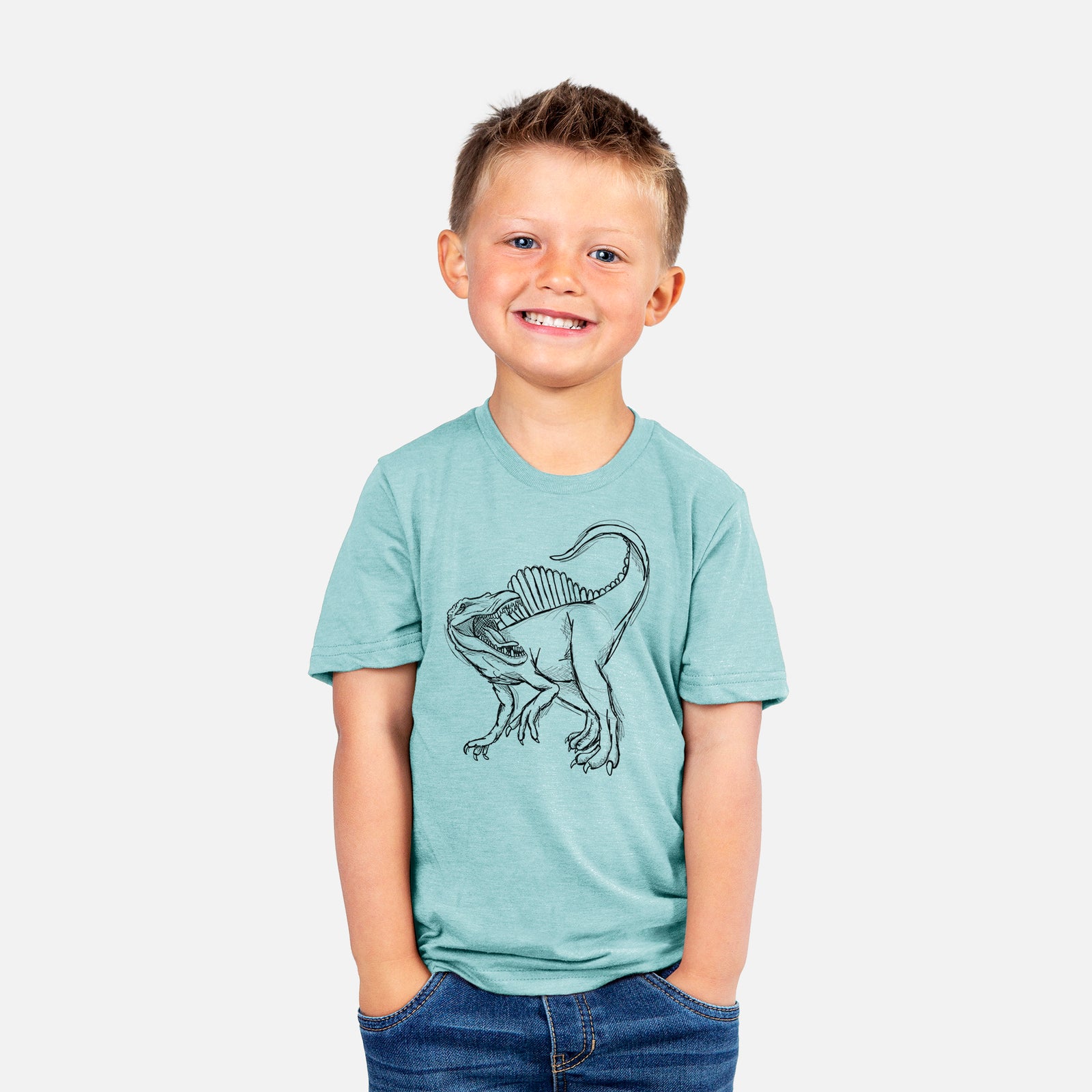 Two youth t-shirts in different colors on hangers, printed with a black ink illustration of a Spinosaurus with its tall sail-shaped back.