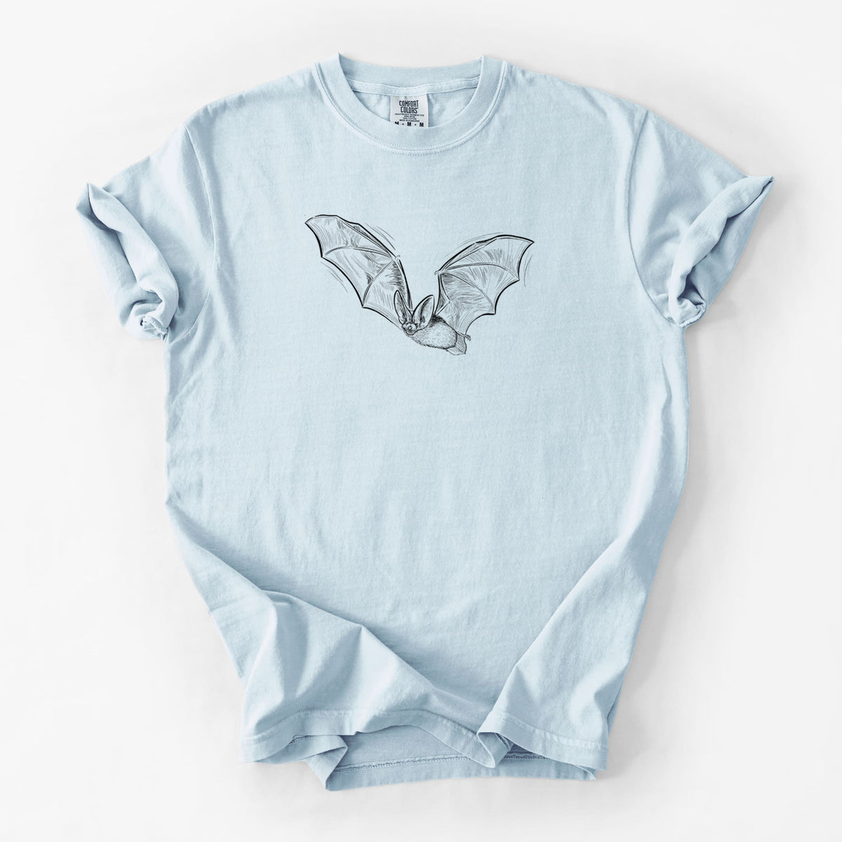 Chambray blue Comfort Colors t-shirt laid flat, printed with a black ink illustration of a spotted bat in flight with large ears.