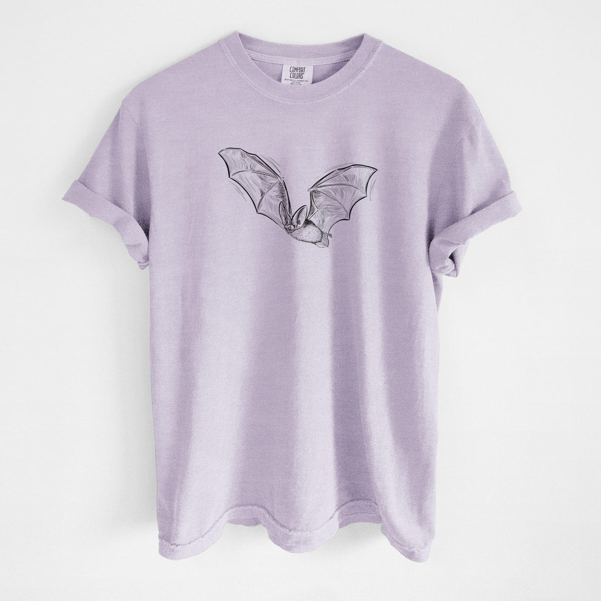 Orchid purple Comfort Colors t-shirt laid flat, printed with a black ink illustration of a spotted bat in flight with large ears.