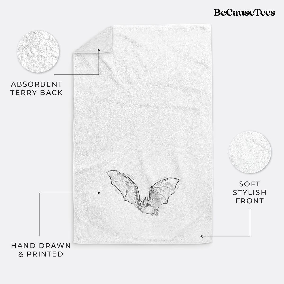 White hand towel printed with a black ink illustration of a spotted bat in flight with large ears.