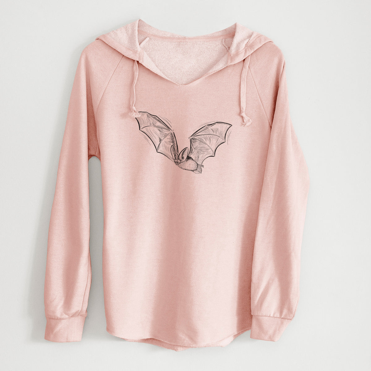 Blush pink women's Cali Wave hooded sweatshirt laid flat, printed with a black ink illustration of a spotted bat in flight with large ears.