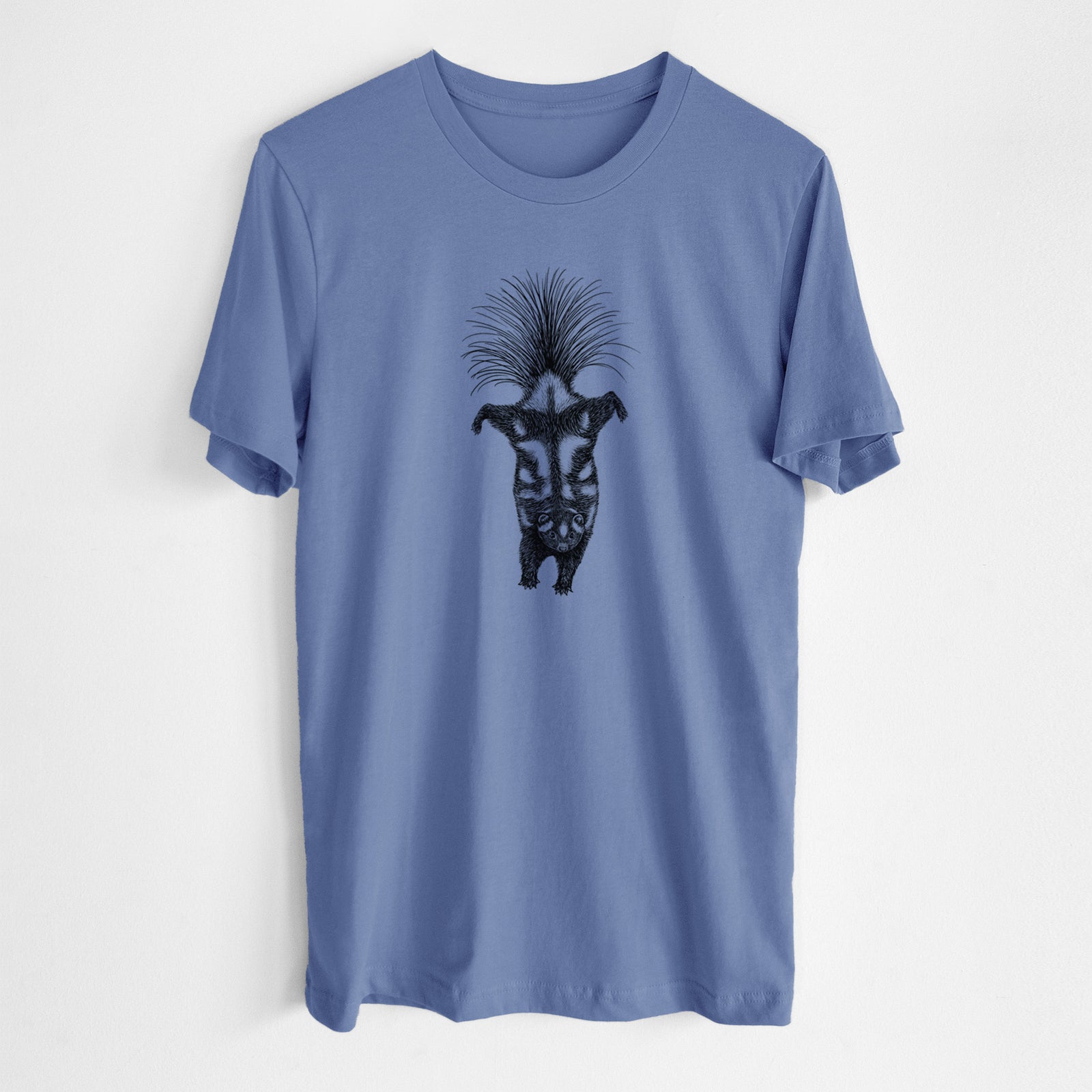 Blue bell lightweight cotton t-shirt laid flat, printed with a black ink illustration of a spotted skunk doing a handstand with its tail fanned.