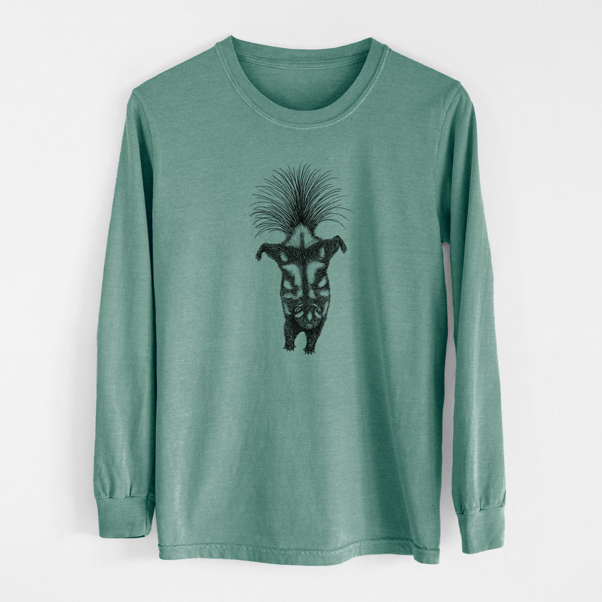 Pine green Comfort Colors long sleeve shirt laid flat, printed with a black ink illustration of a spotted skunk doing a handstand with its tail fanned.