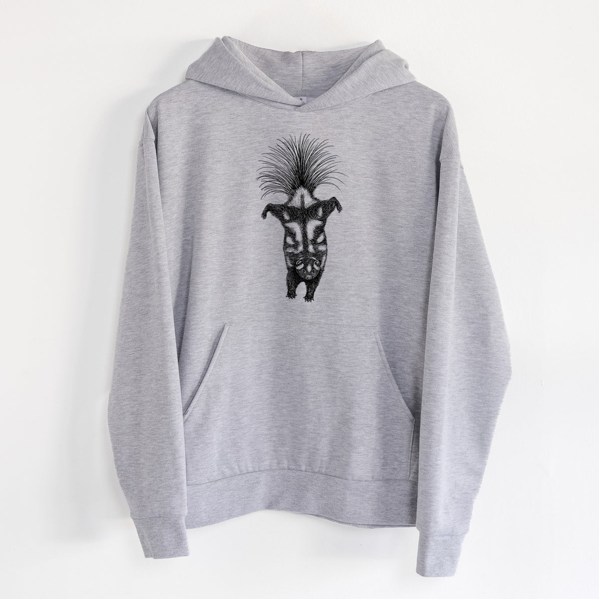 Eastern Spotted Skunk - Spilogale putorius - Statement Midweight Hoodie in Heather Grey, hanging on a white wall, with a front kangaroo pocket and no drawcords.