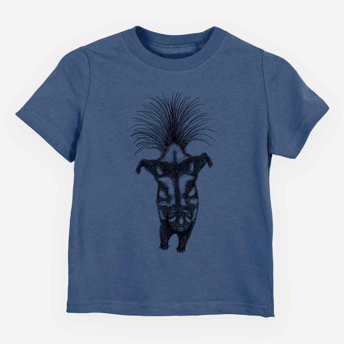 Indigo blue toddler t-shirt laid flat, printed with a black ink illustration of a spotted skunk doing a handstand with its tail fanned.