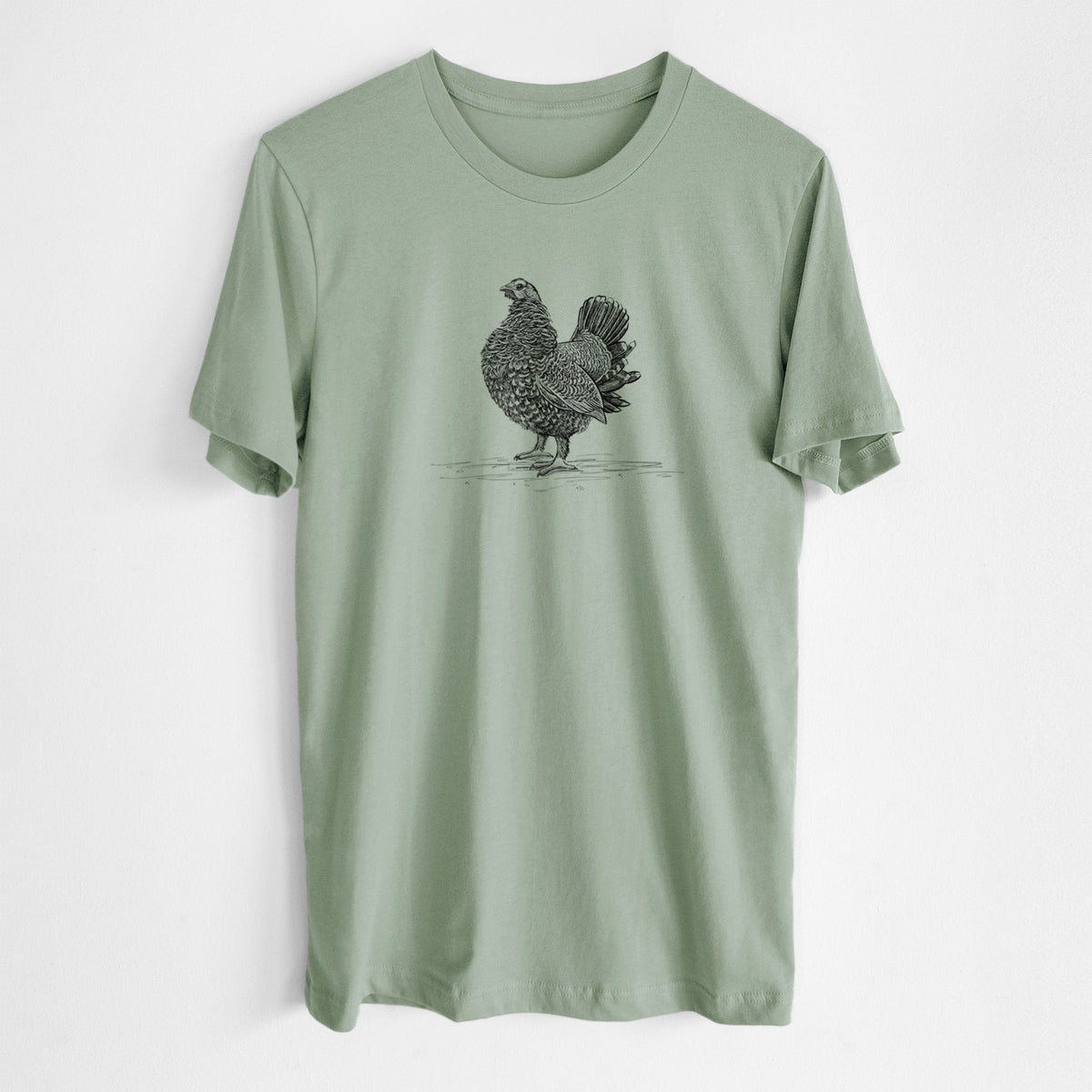Sage green lightweight cotton t-shirt laid flat, printed with a detailed black ink illustration of a spruce grouse standing with its tail fanned.