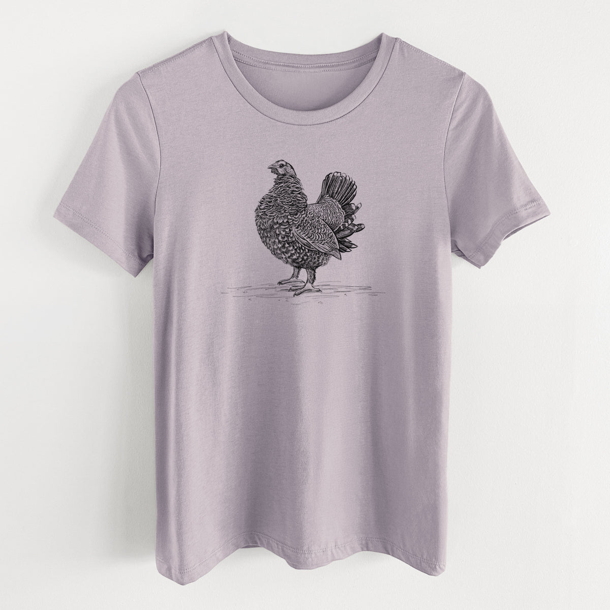 Light violet women's relaxed fit cotton t-shirt laid flat, printed with a detailed black ink illustration of a spruce grouse standing with its tail fanned.