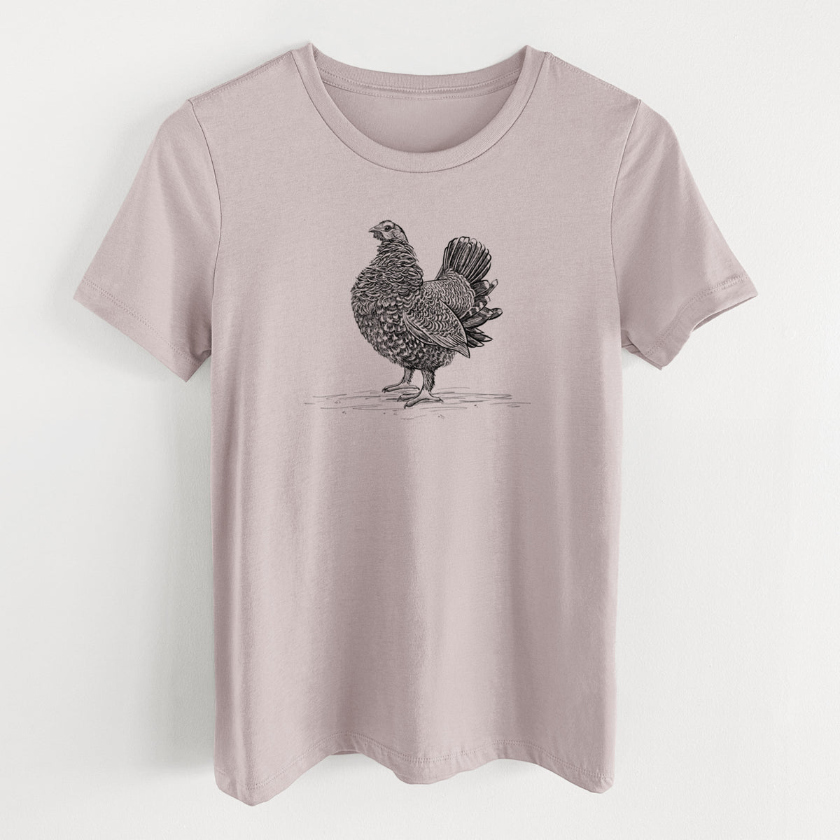 Pink gravel women's relaxed fit cotton t-shirt laid flat, printed with a detailed black ink illustration of a spruce grouse standing with its tail fanned.