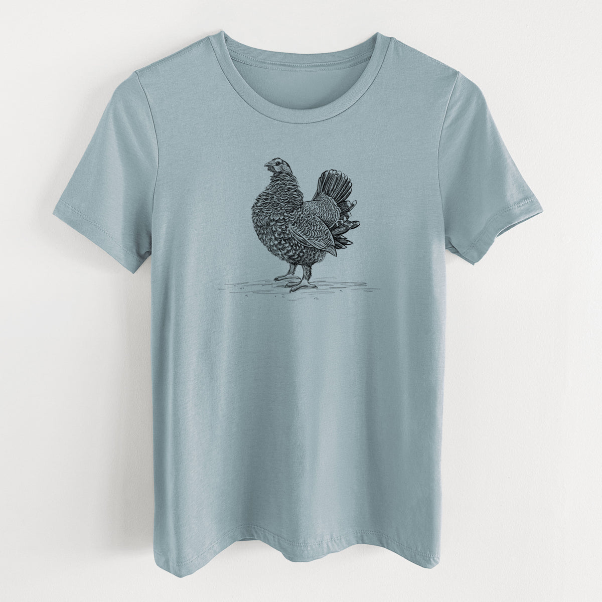 Vintage denim women's relaxed fit cotton t-shirt laid flat, printed with a detailed black ink illustration of a spruce grouse standing with its tail fanned.