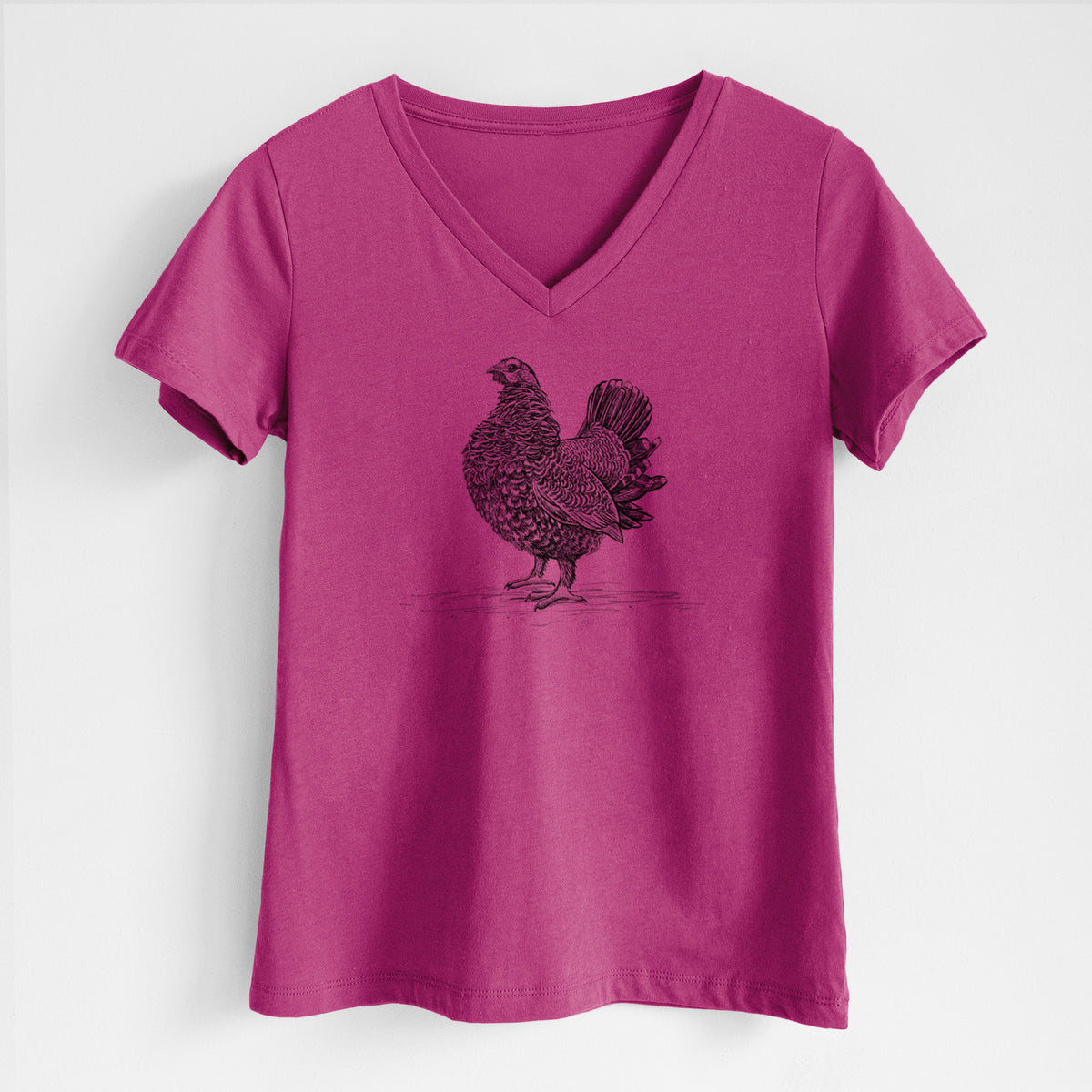 Berry pink women's relaxed fit cotton V-neck t-shirt laid flat, printed with a detailed black ink illustration of a spruce grouse standing with its tail fanned.