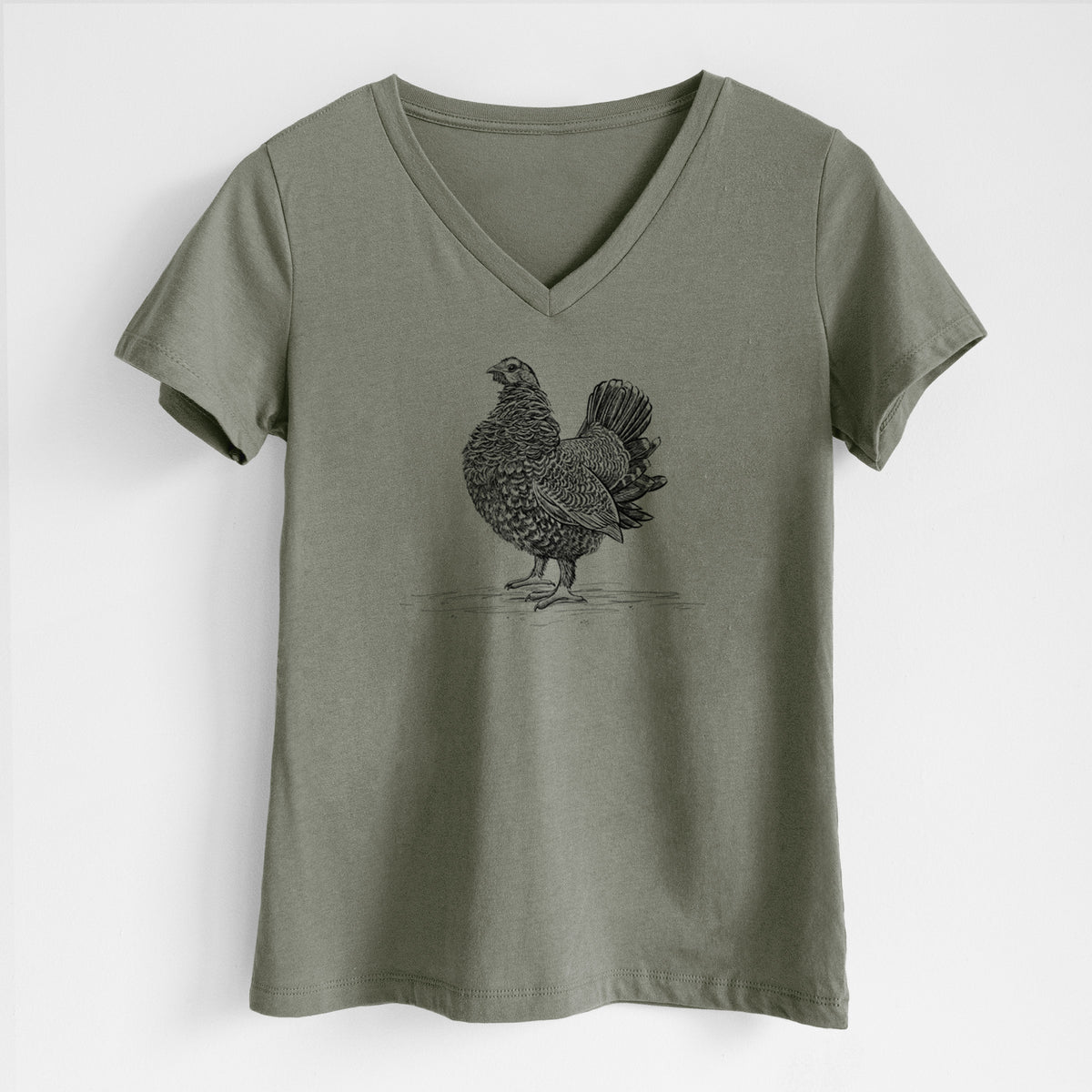 Military green women's relaxed fit cotton V-neck t-shirt laid flat, printed with a detailed black ink illustration of a spruce grouse standing with its tail fanned.
