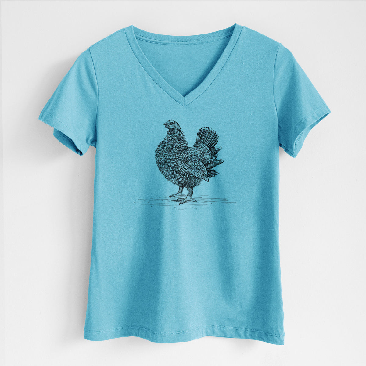 Turquoise women's relaxed fit cotton V-neck t-shirt laid flat, printed with a detailed black ink illustration of a spruce grouse standing with its tail fanned.