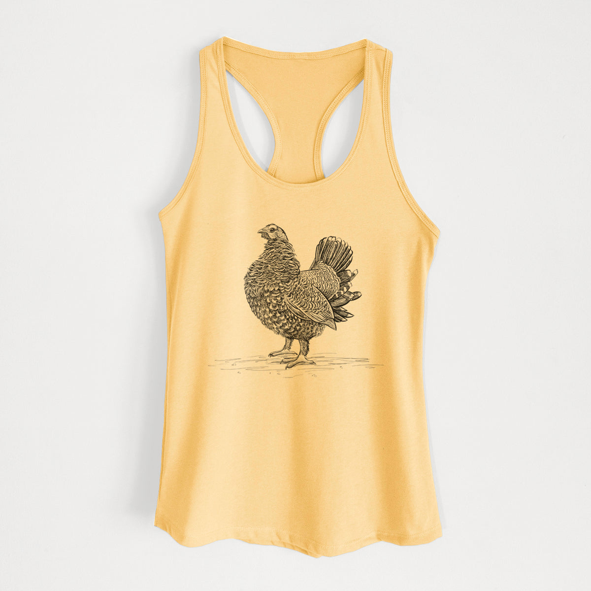 Banana cream women's racerback tank top laid flat, printed with a detailed black ink illustration of a spruce grouse standing with its tail fanned.