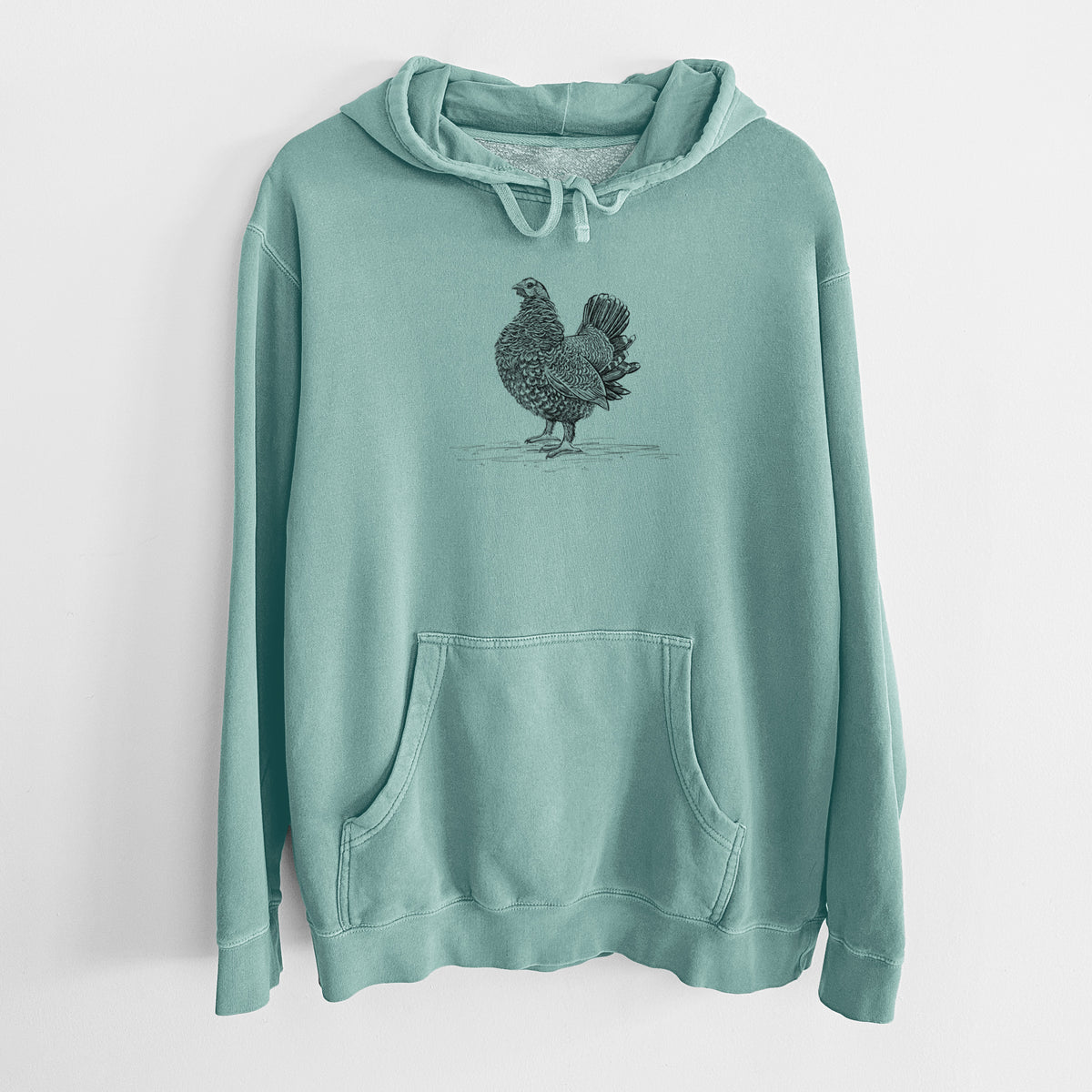 Mint green pigment dyed hoodie laid flat, printed with a detailed black ink illustration of a spruce grouse standing with its tail fanned.