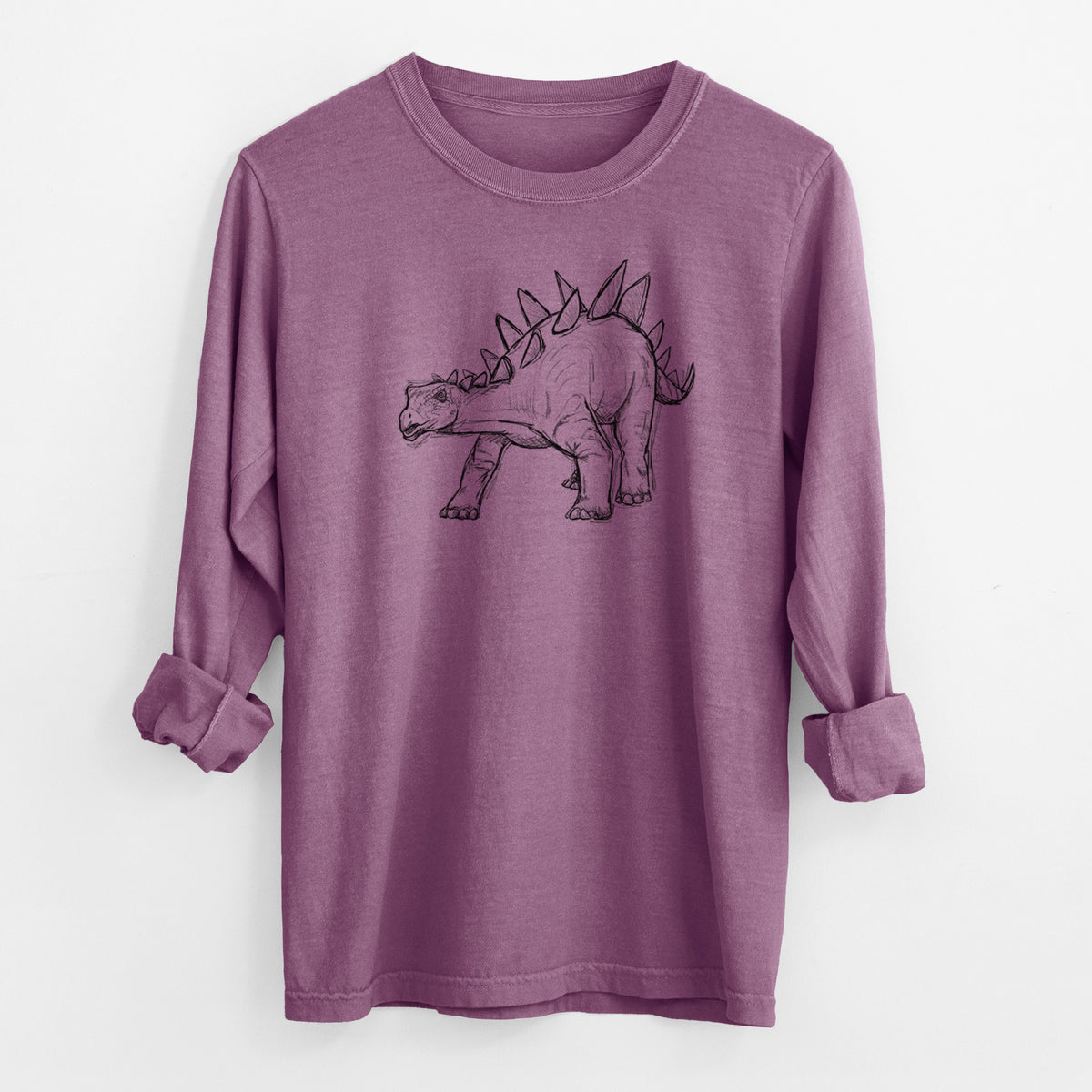 Berry pink Comfort Colors long sleeve shirt laid flat with the cuffs rolled, printed with a black ink illustration of a Stegosaurus with plates along its back.