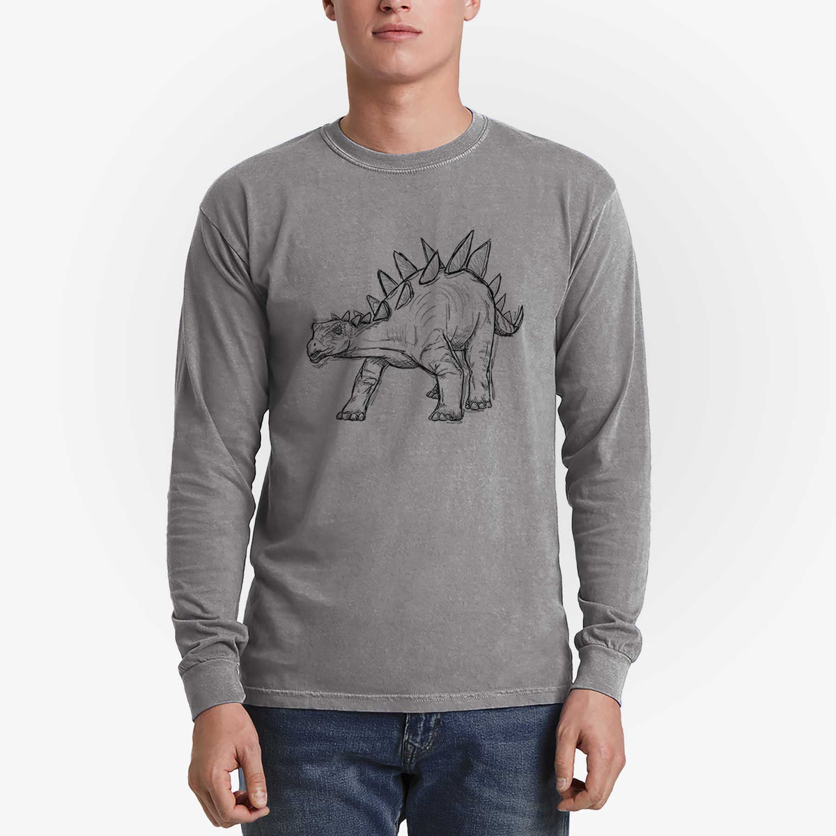 Man wearing a grey Comfort Colors long sleeve shirt printed with a black ink illustration of a Stegosaurus with plates along its back.