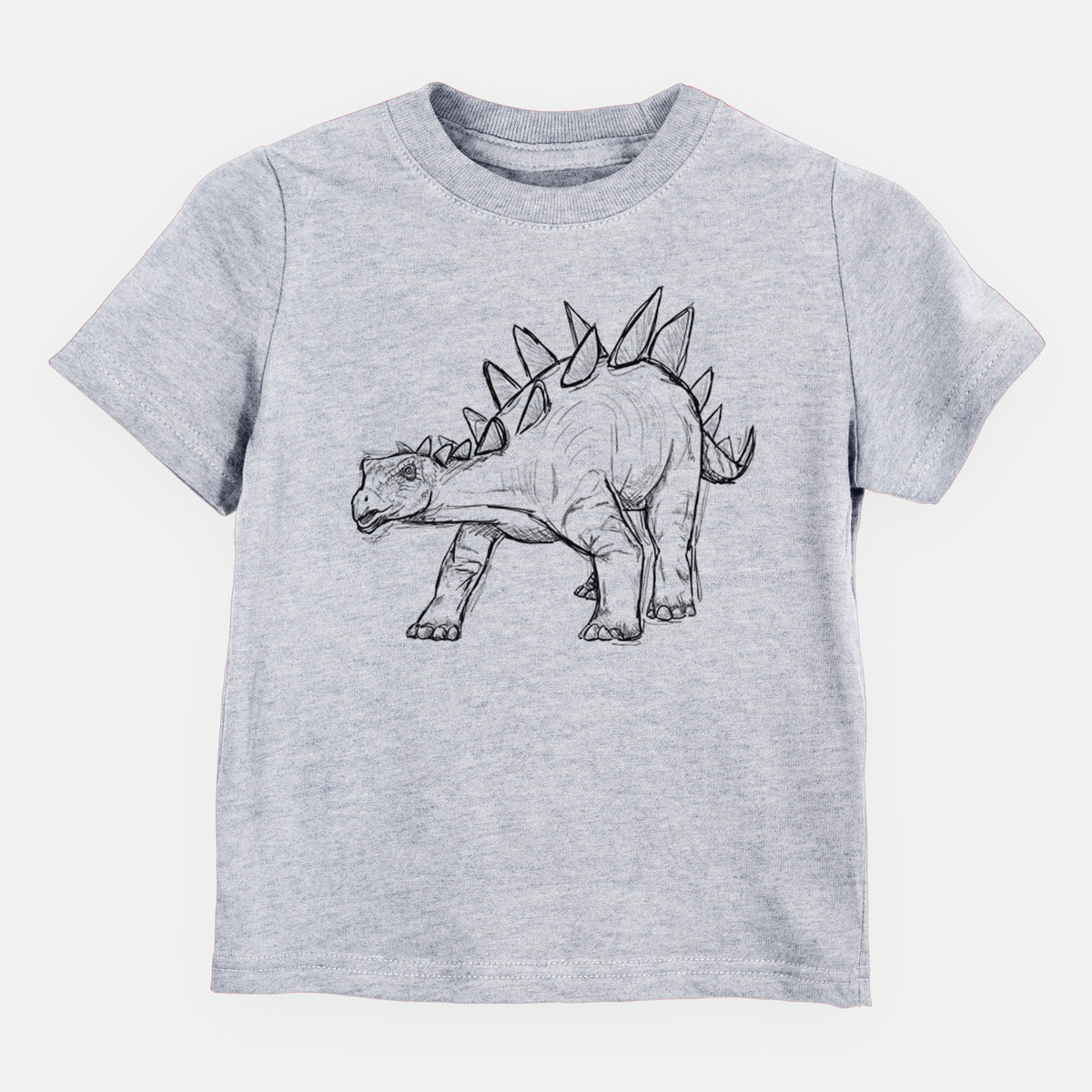 Heather grey toddler t-shirt laid flat, printed with a black ink illustration of a Stegosaurus with plates along its back.