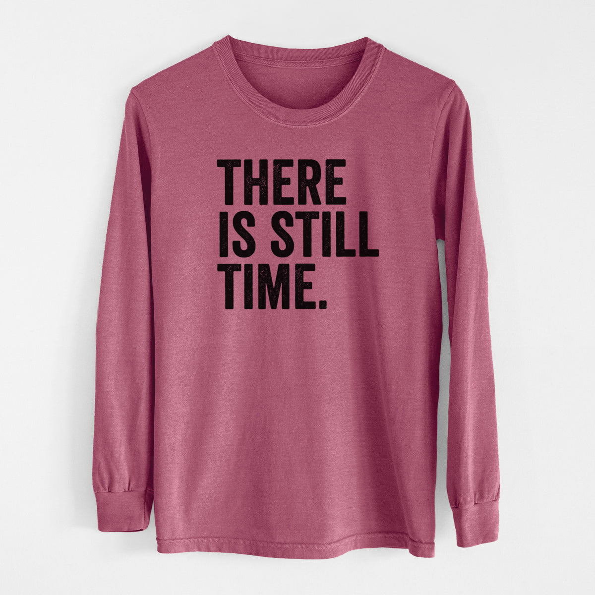 Crimson Comfort Colors long sleeve shirt laid flat, printed with bold black words reading There Is Still Time.