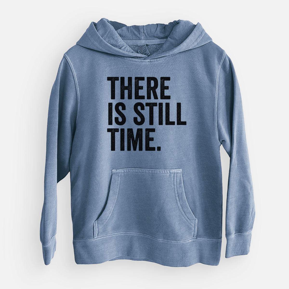 Slate blue youth pigment dyed hoodie laid flat, printed with bold black words reading There Is Still Time.