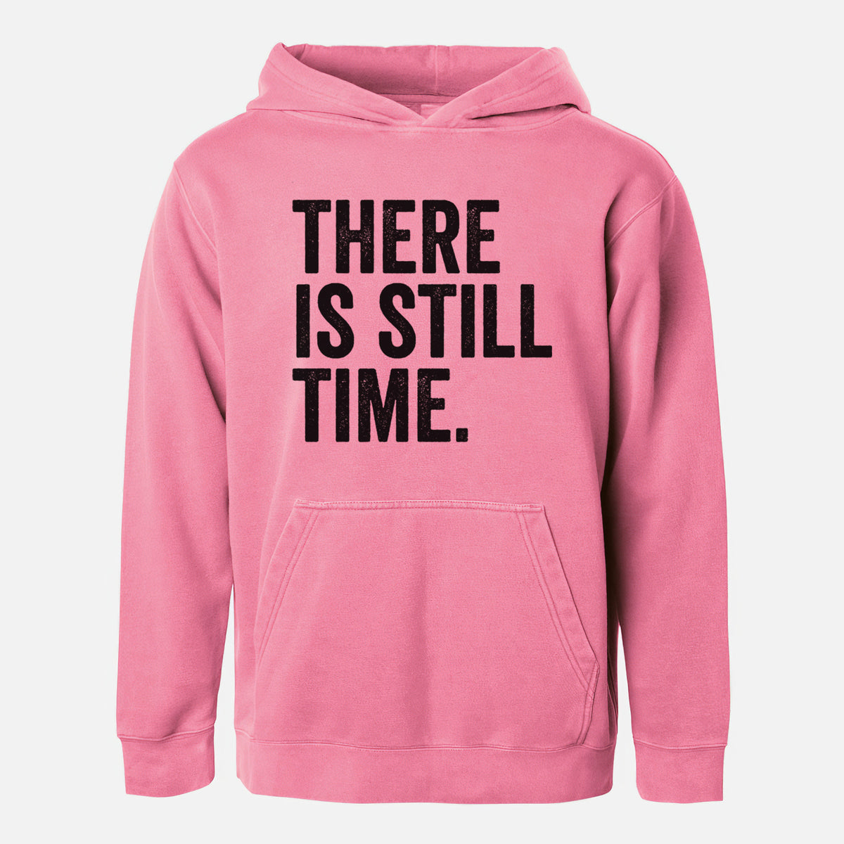 Pigment pink youth pigment dyed hoodie laid flat, printed with bold black words reading There Is Still Time.