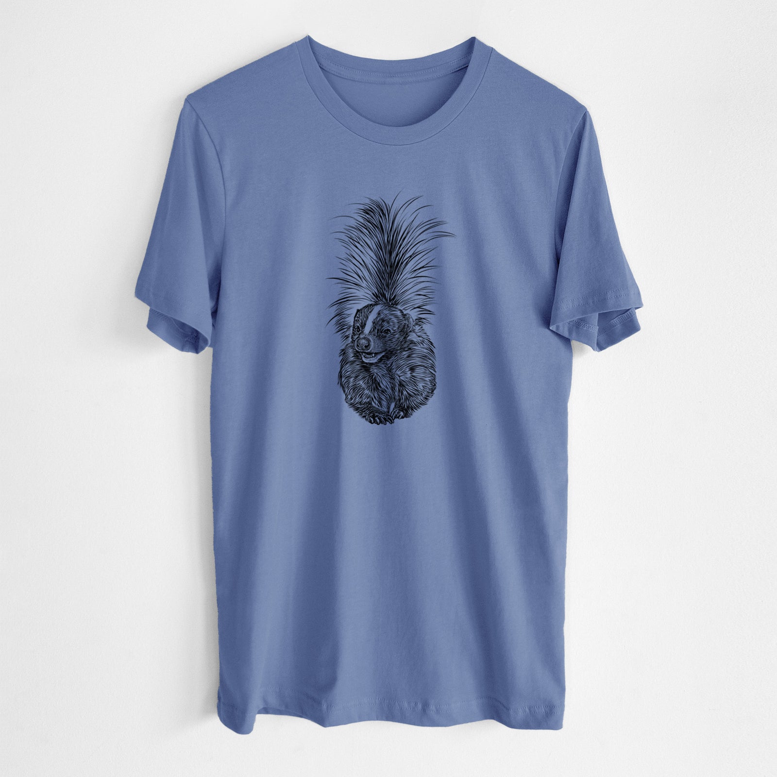 Blue bell lightweight cotton t-shirt laid flat, printed with a detailed black ink illustration of a striped skunk with its tail raised.