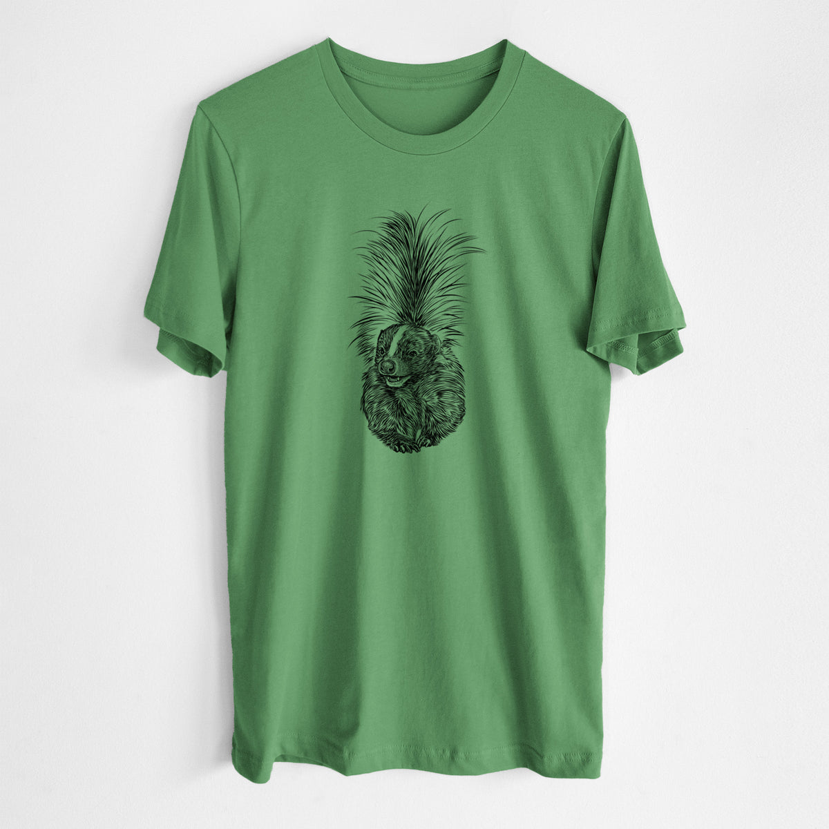 Leaf green lightweight cotton t-shirt laid flat, printed with a detailed black ink illustration of a striped skunk with its tail raised.
