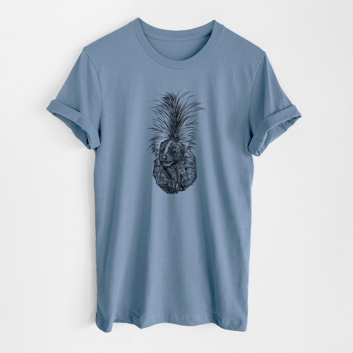 Steel blue lightweight cotton t-shirt laid flat, printed with a detailed black ink illustration of a striped skunk with its tail raised.