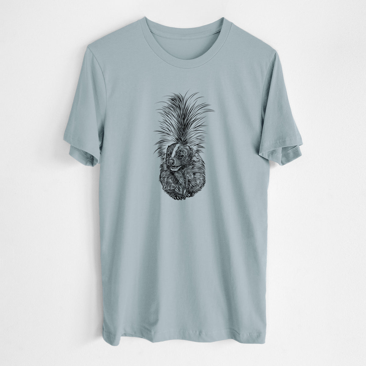 Vintage denim lightweight cotton t-shirt laid flat, printed with a detailed black ink illustration of a striped skunk with its tail raised.