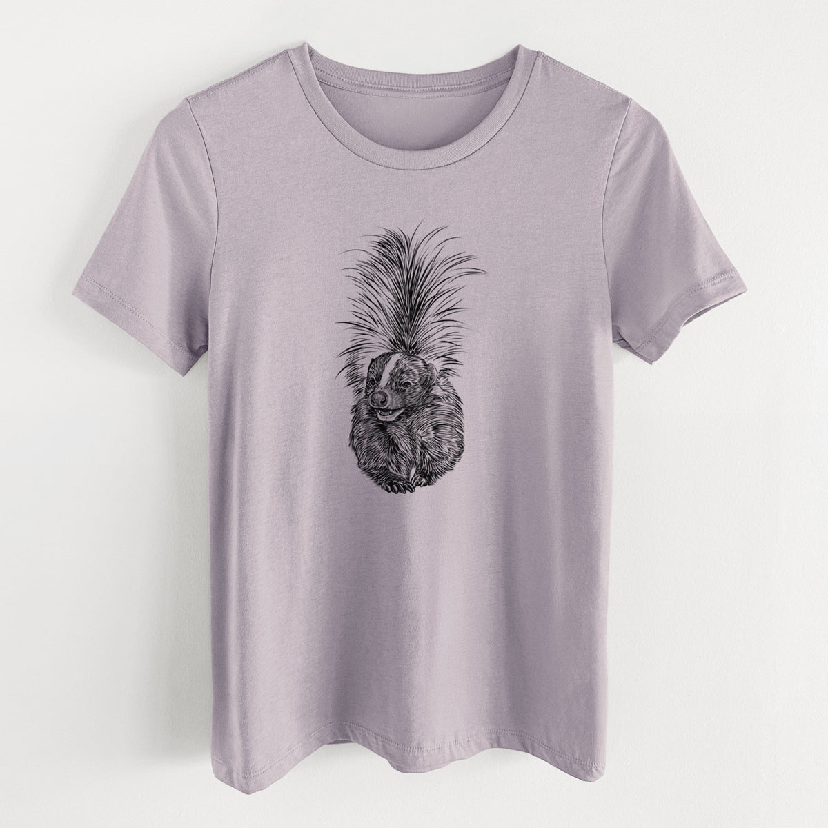 Light violet women's relaxed fit cotton t-shirt laid flat, printed with a detailed black ink illustration of a striped skunk with its tail raised.