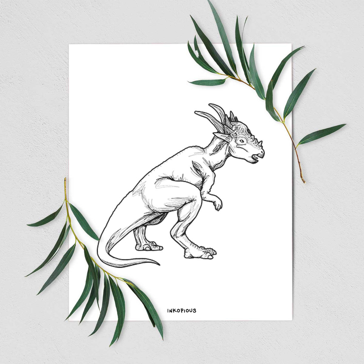 Art print of a black ink illustration of a Stygimoloch dinosaur with a spiky domed head, shown with eucalyptus leaves.