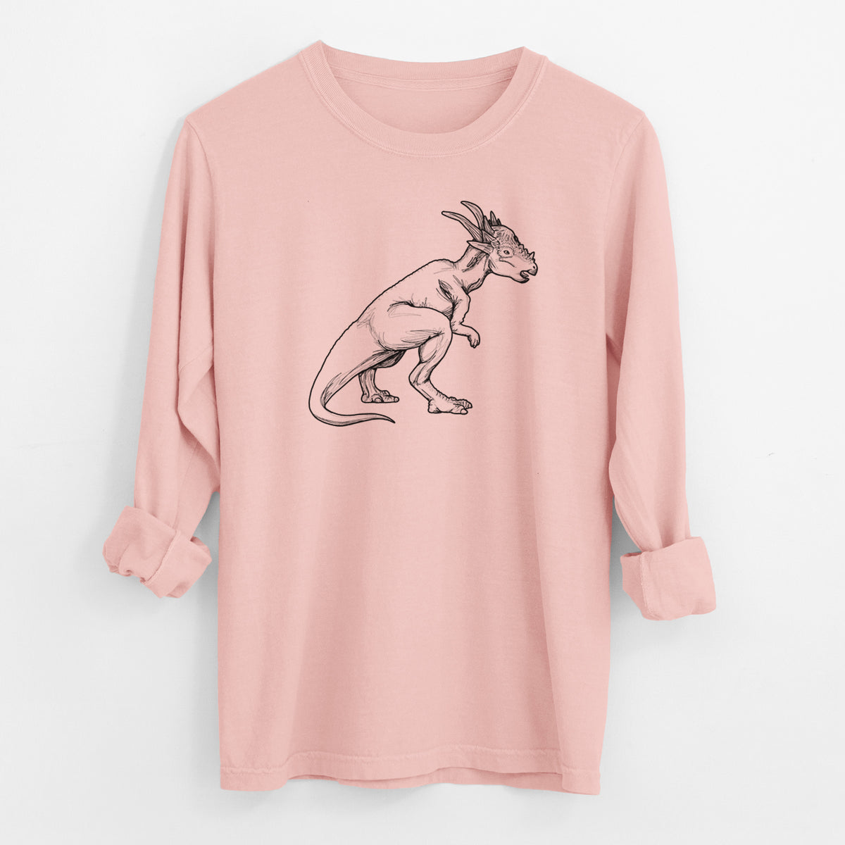 Peachy Comfort Colors long sleeve shirt laid flat with the cuffs rolled, printed with a black ink illustration of a Stygimoloch dinosaur with a spiky domed head.
