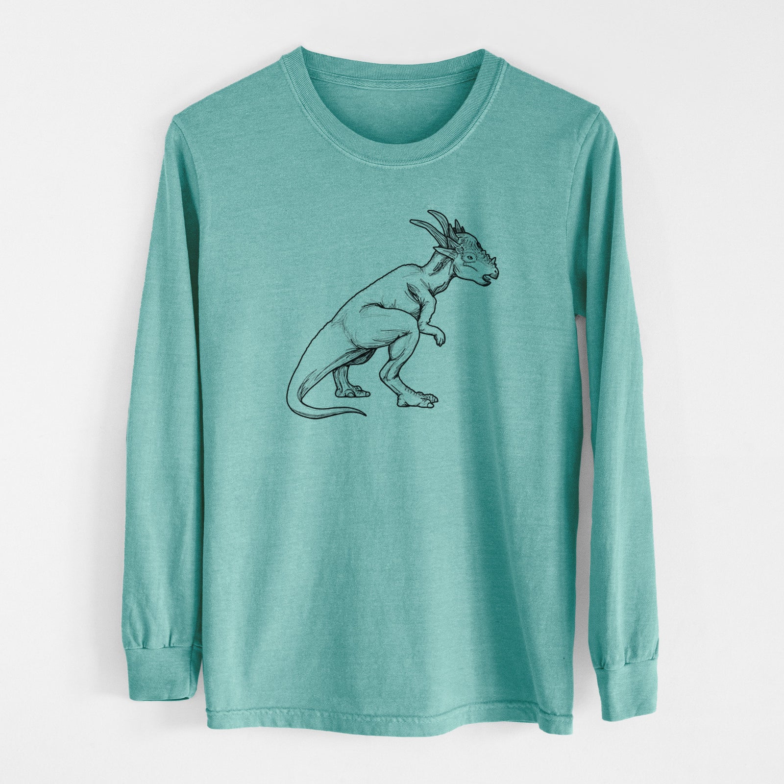 Reef green Comfort Colors long sleeve shirt laid flat, printed with a black ink illustration of a Stygimoloch dinosaur with a spiky domed head.